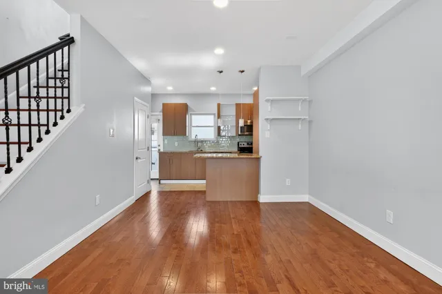 a view of kitchen with wooden floor