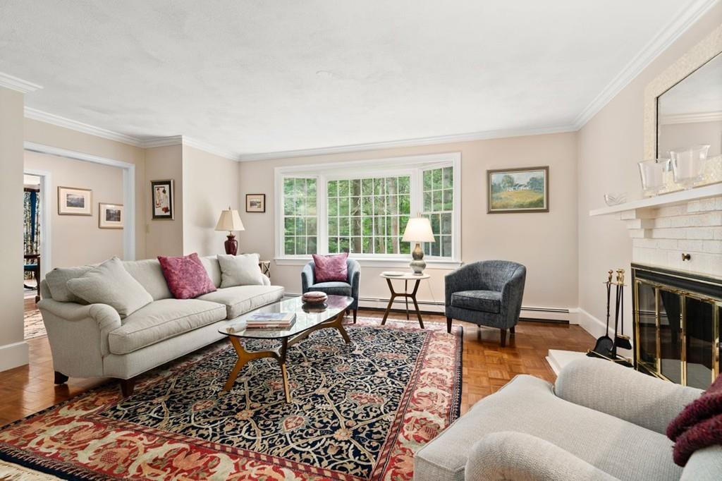 228 Cochituate Road Wayland, MA 01778 - Photo 12 of 32 a living room with furniture fireplace and a window