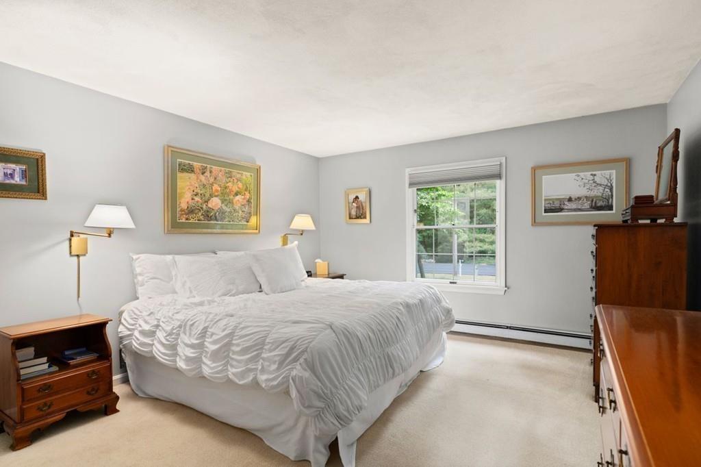 228 Cochituate Road Wayland, MA 01778 - Photo 15 of 32 a bedroom with a bed dresser and a window