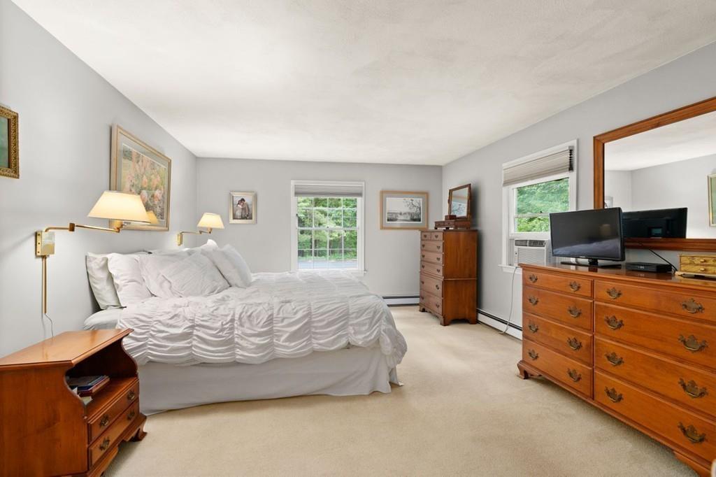 228 Cochituate Road Wayland, MA 01778 - Photo 16 of 32 a bedroom with a bed and flat screen tv