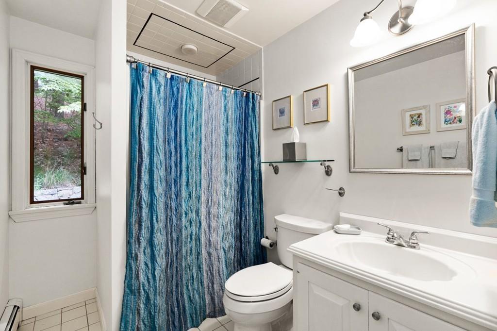 228 Cochituate Road Wayland, MA 01778 - Photo 17 of 32 a bathroom with a sink a toilet and shower