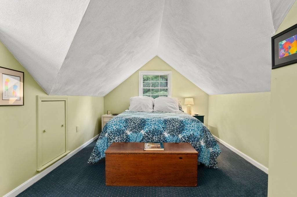 228 Cochituate Road Wayland, MA 01778 - Photo 20 of 32 a room with a bed and cabinets