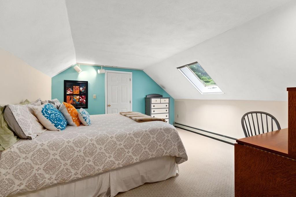 228 Cochituate Road Wayland, MA 01778 - Photo 24 of 32 a bedroom with a bed and dresser