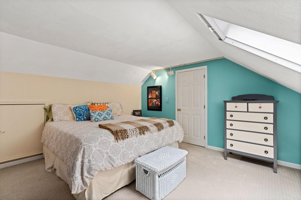 228 Cochituate Road Wayland, MA 01778 - Photo 25 of 32 a bedroom with a bed and a television