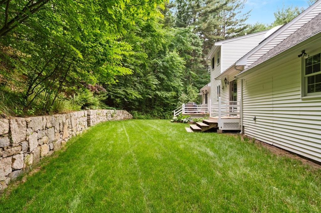 228 Cochituate Road Wayland, MA 01778 - Photo 27 of 32 a view of a backyard with white house