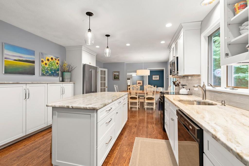 228 Cochituate Road Wayland, MA 01778 - Photo 6 of 32 a large kitchen with granite countertop a sink and cabinets