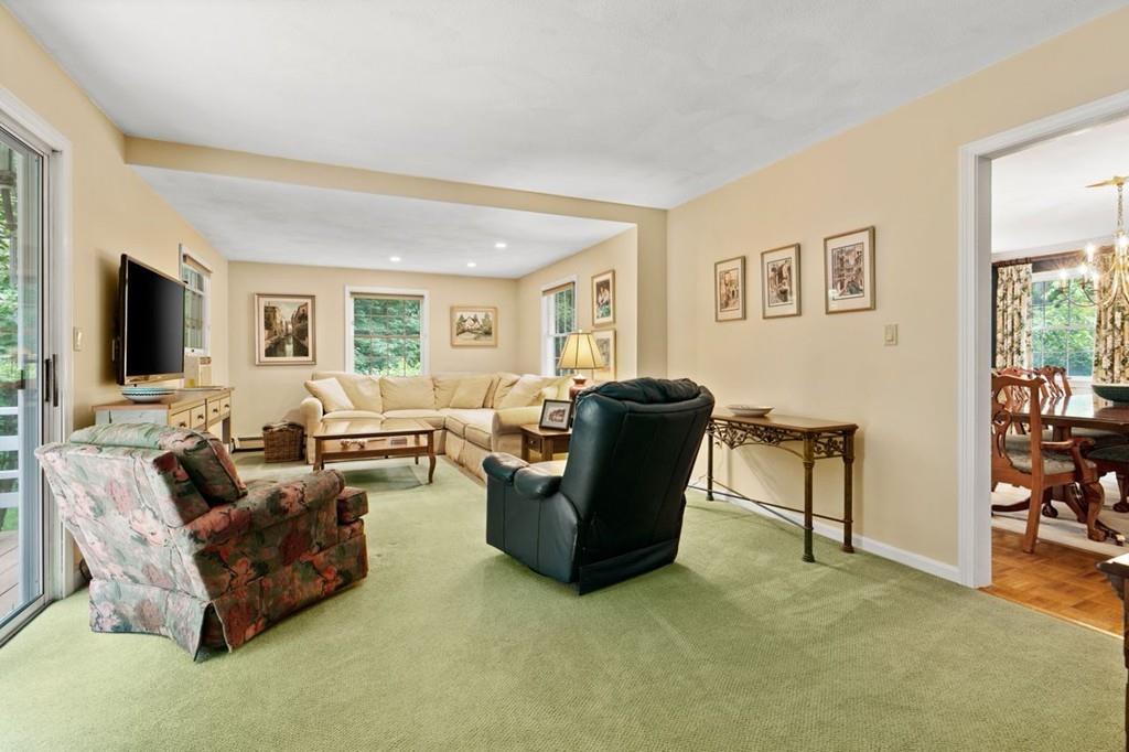228 Cochituate Road Wayland, MA 01778 - Photo 9 of 32 a living room with furniture and a flat screen tv
