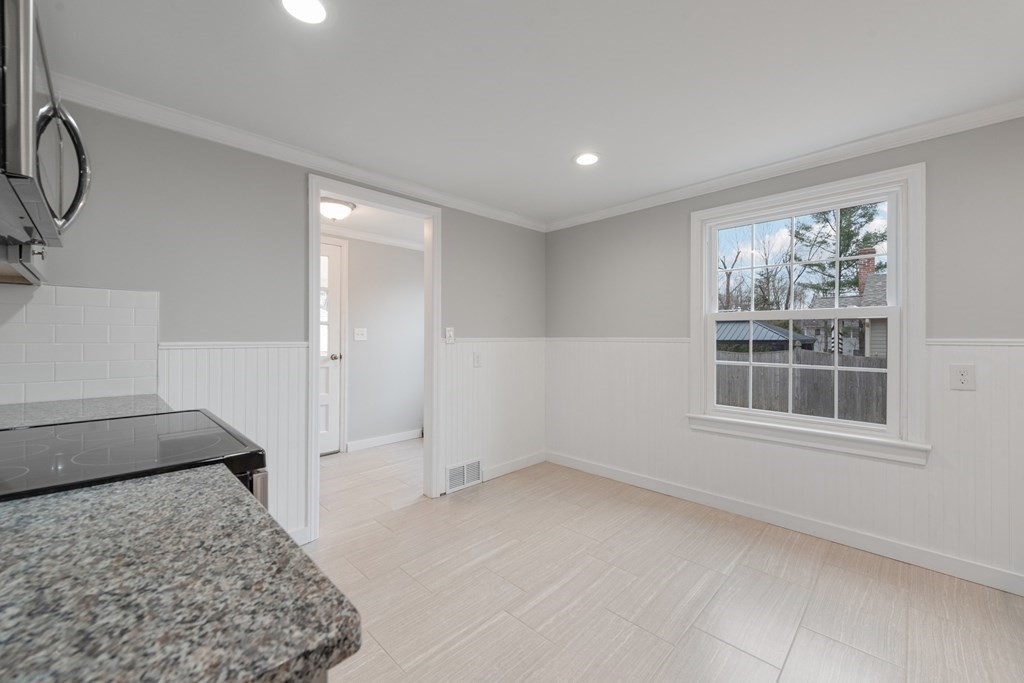 438 Tinkham Road Springfield, MA 01129 - Photo 3 of 23 a view of empty room with windows