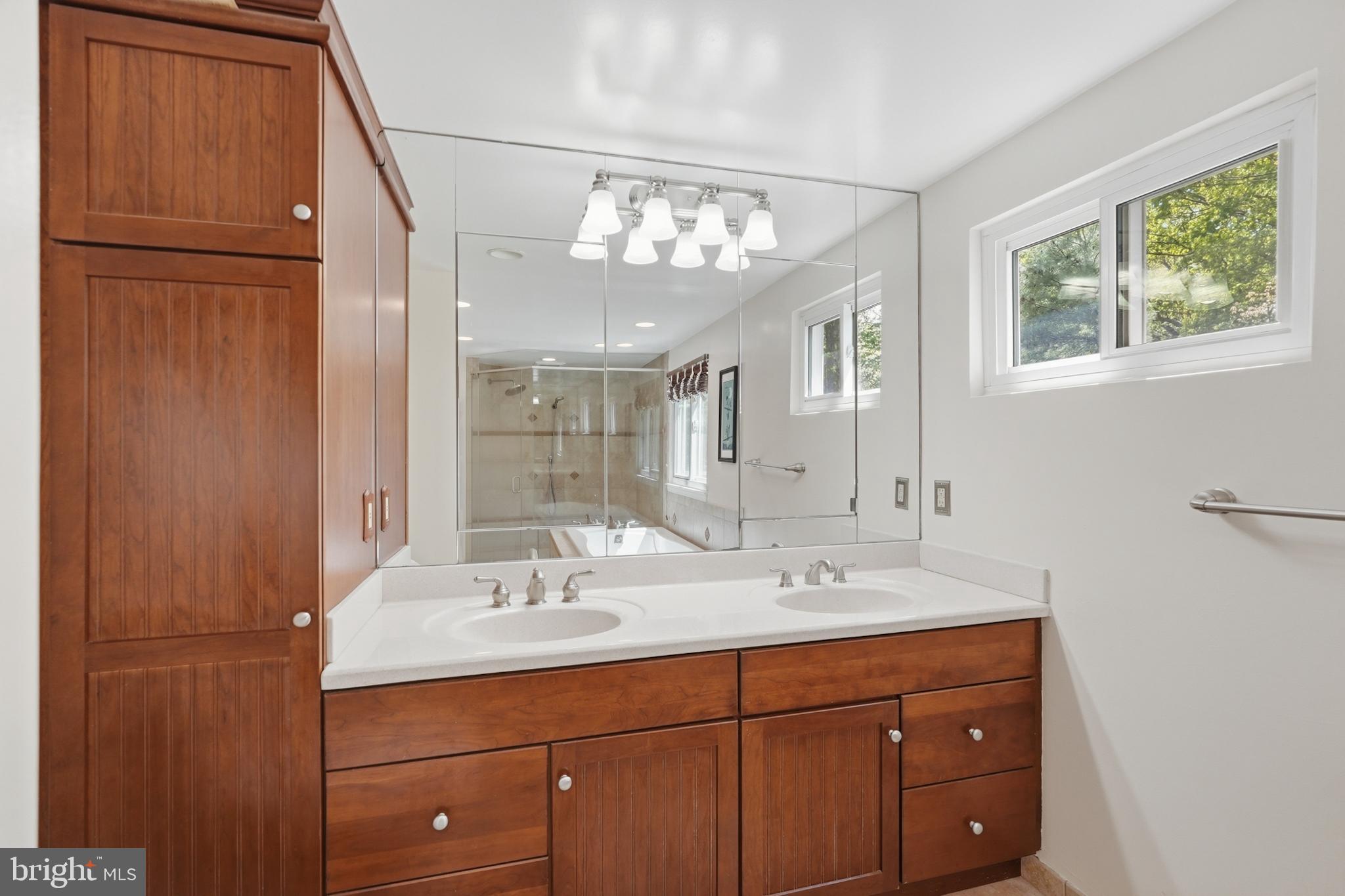 7006 Barnack Drive Springfield, VA 22152 - Photo 31 of 56 a bathroom with a sink double vanity and a mirror