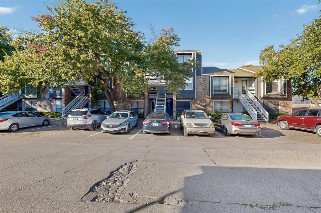 5840 Spring Valley Road, Unit 810 Dallas, TX 75254 - Photo 2 of 40 a view of a street with cars