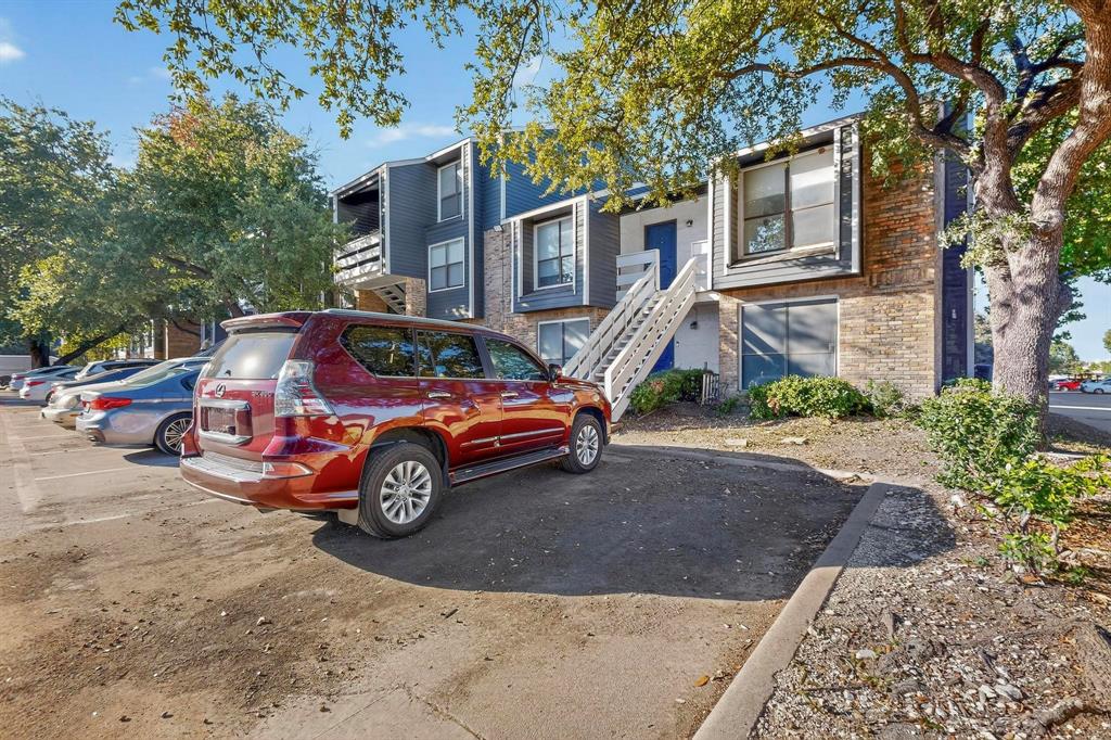 5840 Spring Valley Road, Unit 810 Dallas, TX 75254 - Photo 3 of 40 a car parked in front of a house
