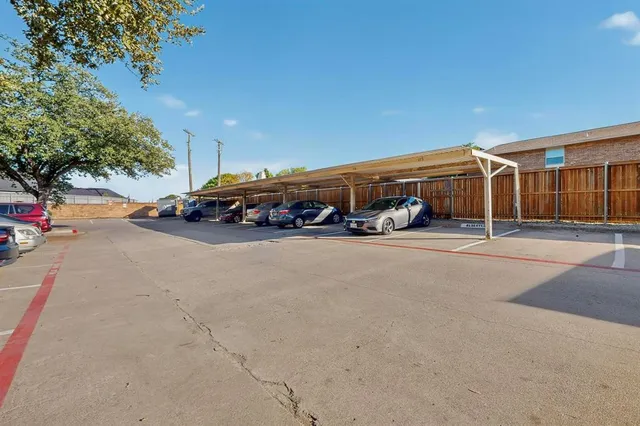 a view of a yard with large trees