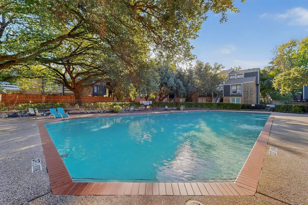 5840 Spring Valley Road, Unit 810 Dallas, TX 75254 - Photo 37 of 40 a view of a yard with large trees