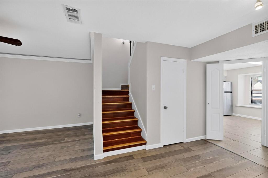 5840 Spring Valley Road, Unit 810 Dallas, TX 75254 - Photo 8 of 40 a view of a room with wooden floor and white doors