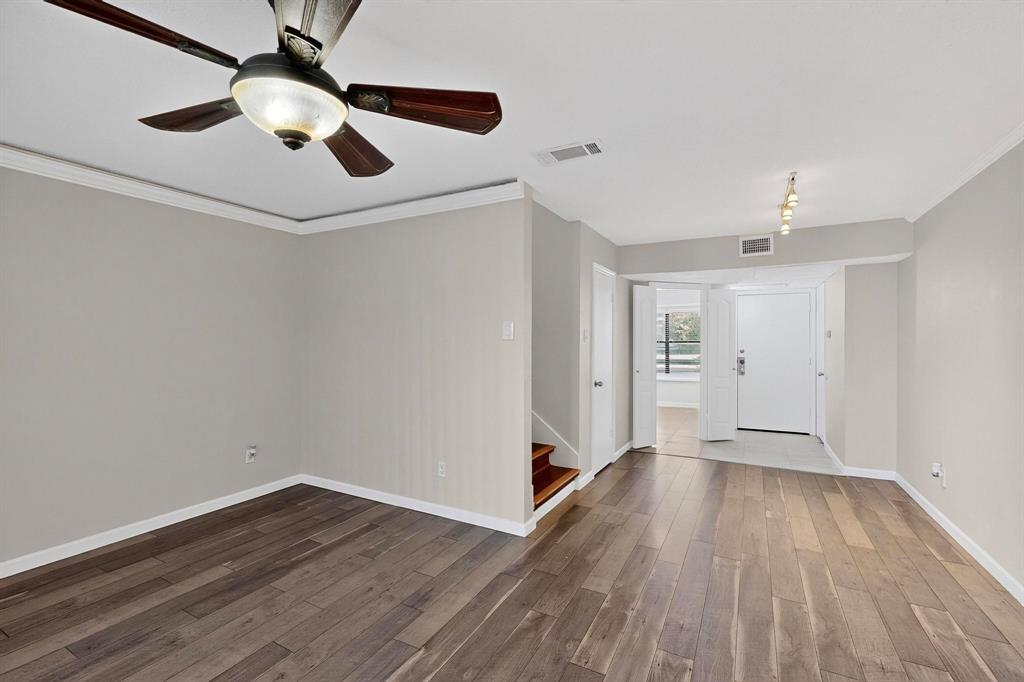 5840 Spring Valley Road, Unit 810 Dallas, TX 75254 - Photo 9 of 40 a view of an empty room with wooden floor