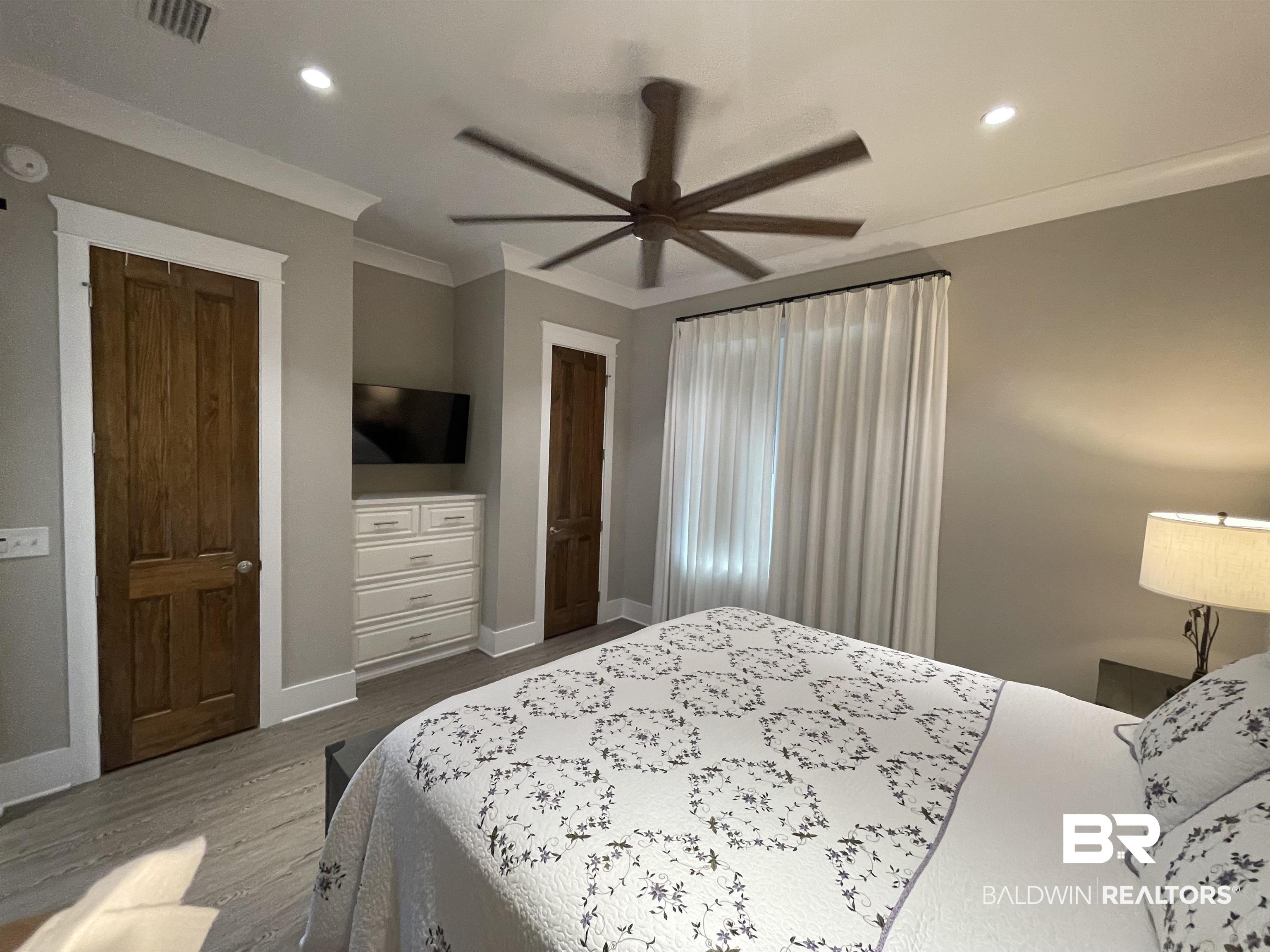 6 Fairhope Motorcoach Loop Fairhope, AL 36532 - Photo 17 of 33 Bedroom with ceiling fan, ornamental molding, and hardwood / wood-style floors