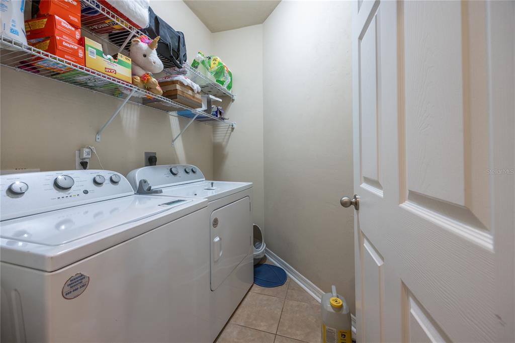 7550 Southwest 81st Way Gainesville, FL 32608 - Photo 24 of 31 a utility room with dryer and washer