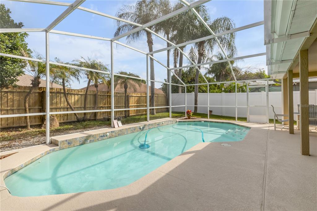 12232 Bronson Way Orlando, FL 32824 - Photo 23 of 32 a view of a house with a swimming pool
