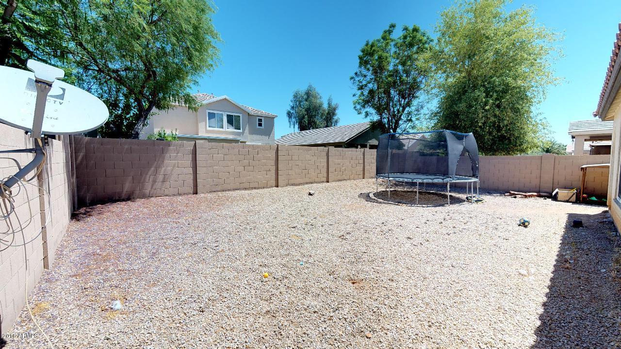 15038 West Wethersfield Road Surprise, AZ 85379 - Photo 36 of 40 tmaMer3vLHU - Backyard Left Side