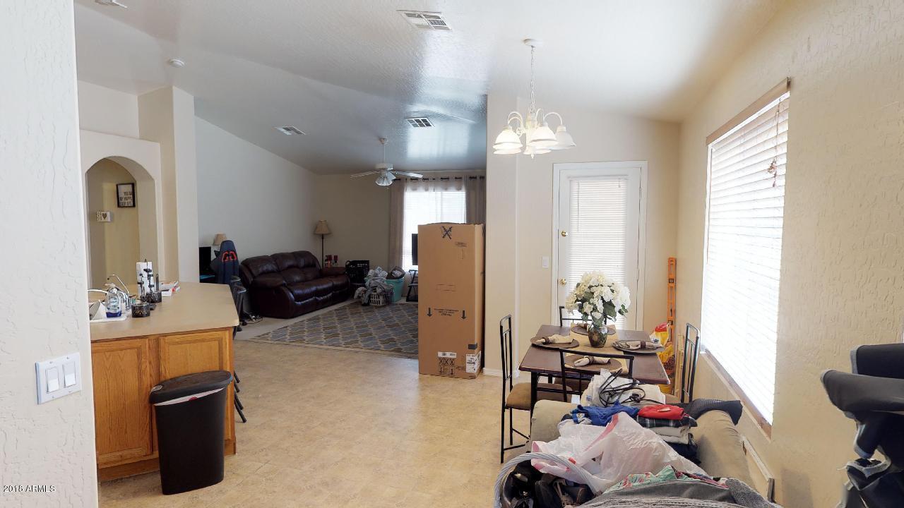 15038 West Wethersfield Road Surprise, AZ 85379 - Photo 9 of 40 Great Room