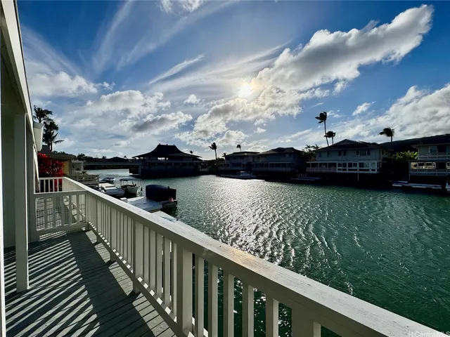 a view of a balcony with wooden floor