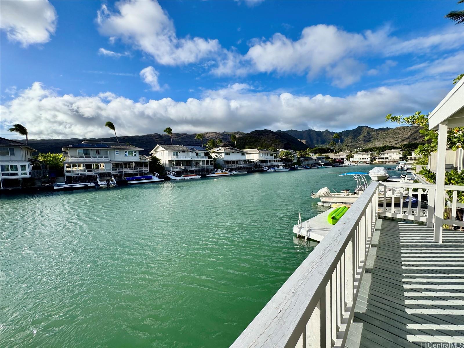 369 Opihikao Place, Unit 352 Honolulu, HI 96825 - Photo 14 of 25 a view of a lake with a car park