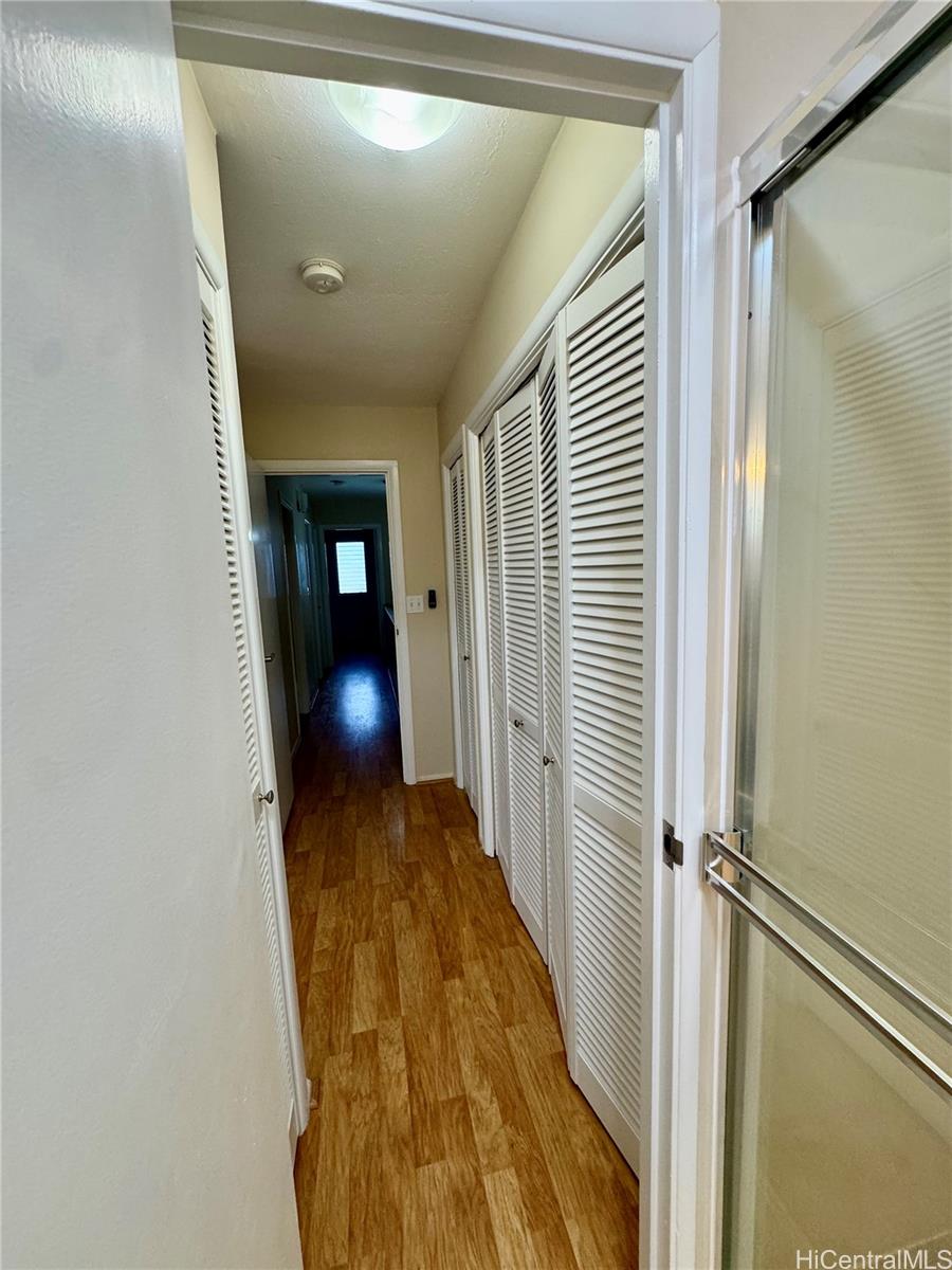 369 Opihikao Place, Unit 352 Honolulu, HI 96825 - Photo 17 of 25 a view of a hallway with wooden floor and staircase