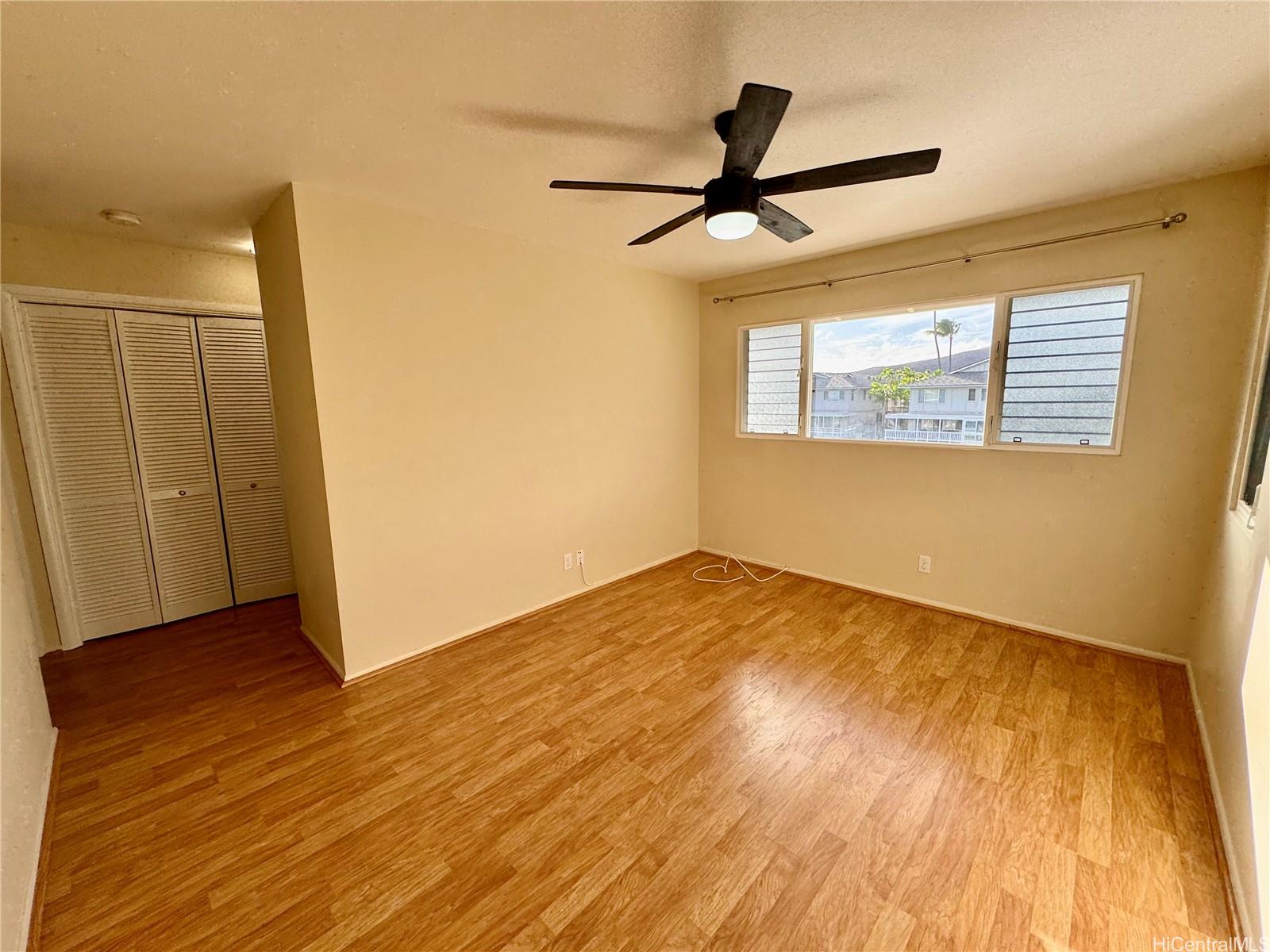 369 Opihikao Place, Unit 352 Honolulu, HI 96825 - Photo 18 of 25 a view of empty room with wooden floor and fan