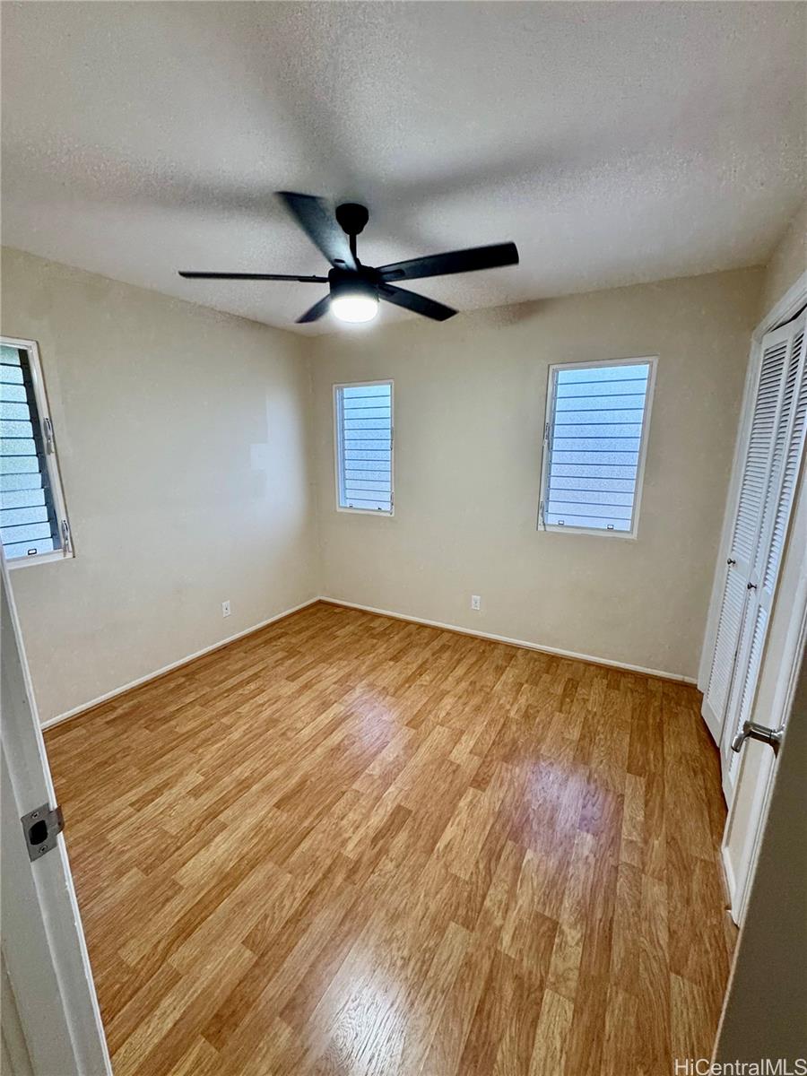 369 Opihikao Place, Unit 352 Honolulu, HI 96825 - Photo 22 of 25 a view of empty room with wooden floor and fan