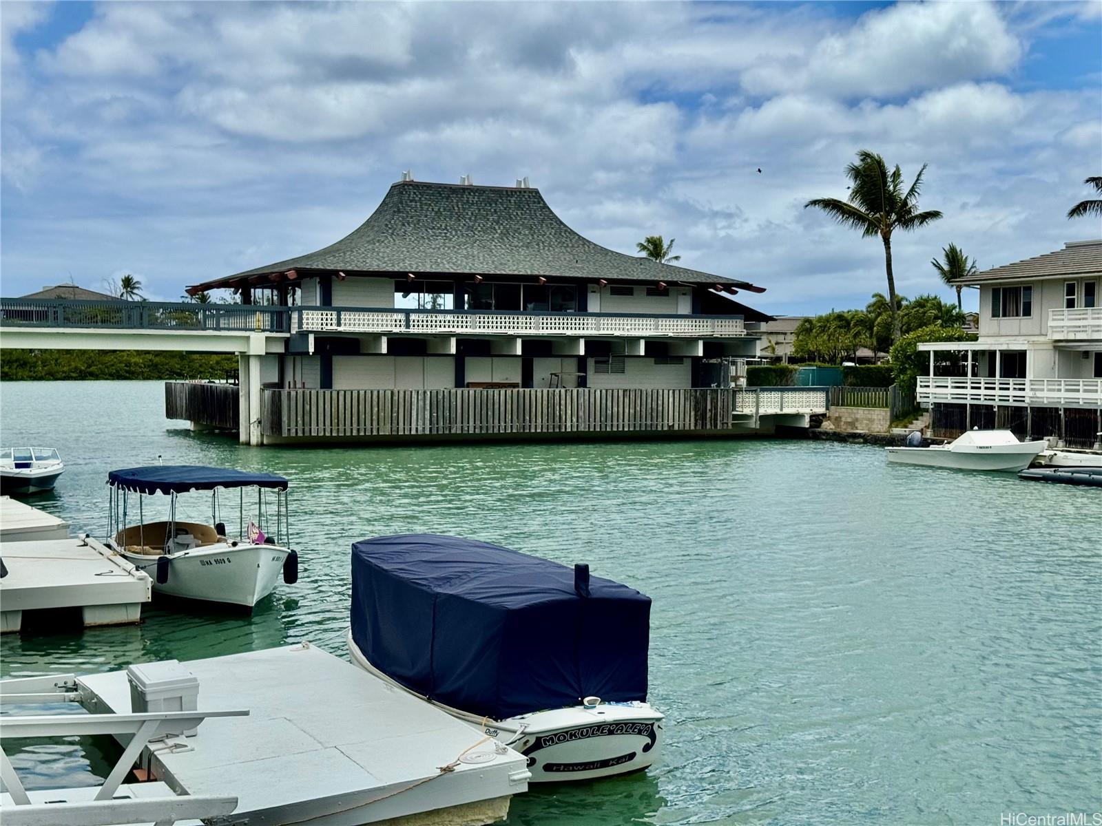 369 Opihikao Place, Unit 352 Honolulu, HI 96825 - Photo 3 of 25 a front view of a house with a garden and car parked