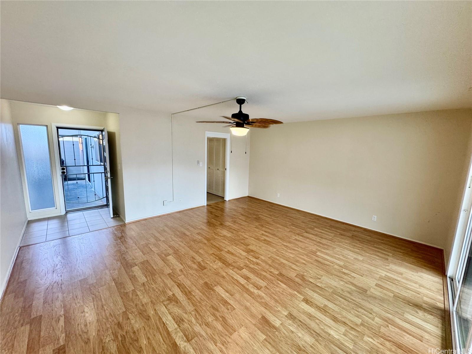 369 Opihikao Place, Unit 352 Honolulu, HI 96825 - Photo 5 of 25 a view of empty room with wooden floor and fan