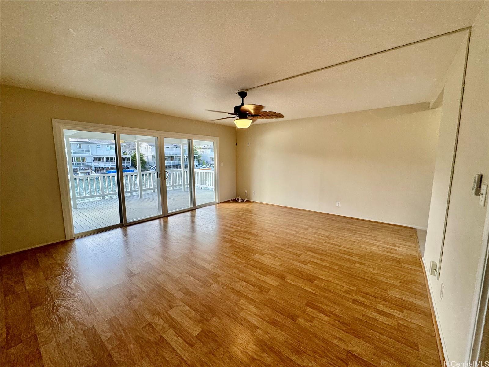 369 Opihikao Place, Unit 352 Honolulu, HI 96825 - Photo 7 of 25 wooden floor in an empty room with a window