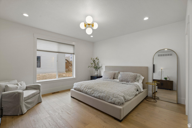 3349 Oxford Loop Morgan, UT 84050 - Photo 16 of 47 Bedroom featuring light wood finished floors and recessed lighting