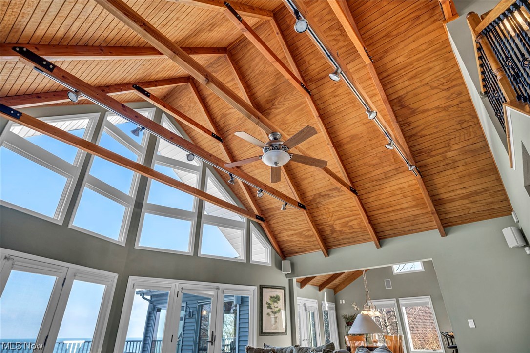 4741 Lake Road West Ashtabula, OH 44004 - Photo 9 of 43 Room details with ceiling fan, beam ceiling, track lighting, and wooden ceiling