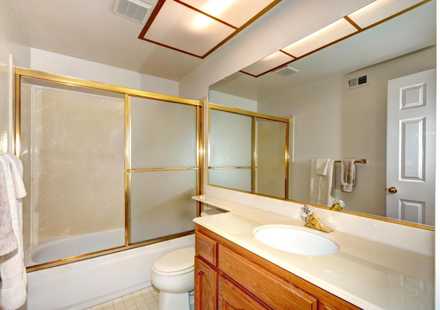 2201 Pinard Street Milpitas, CA 95035 - Photo 16 of 26 a bathroom with a granite countertop sink toilet and shower