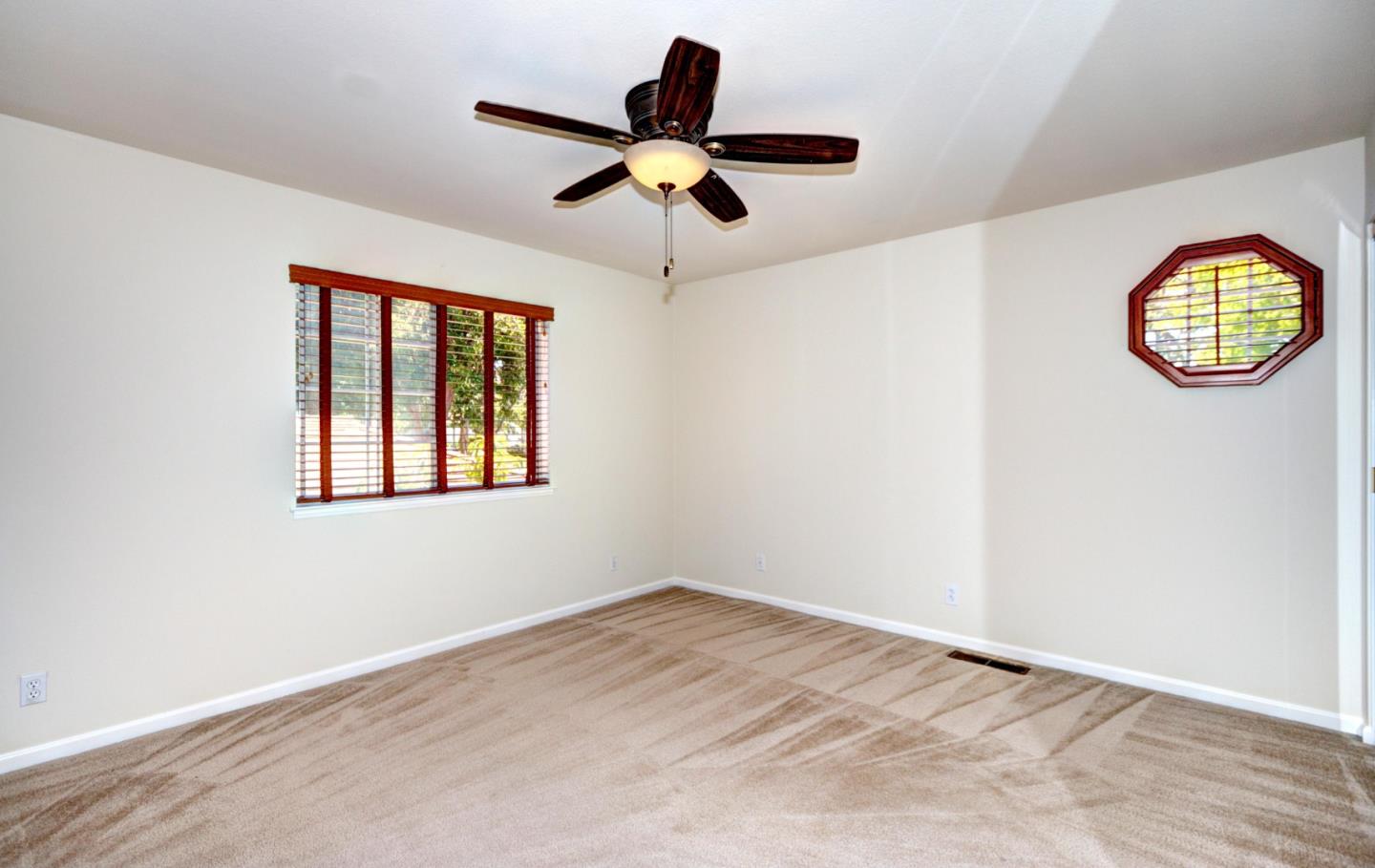 2201 Pinard Street Milpitas, CA 95035 - Photo 17 of 26 an empty room with ceiling fan and window