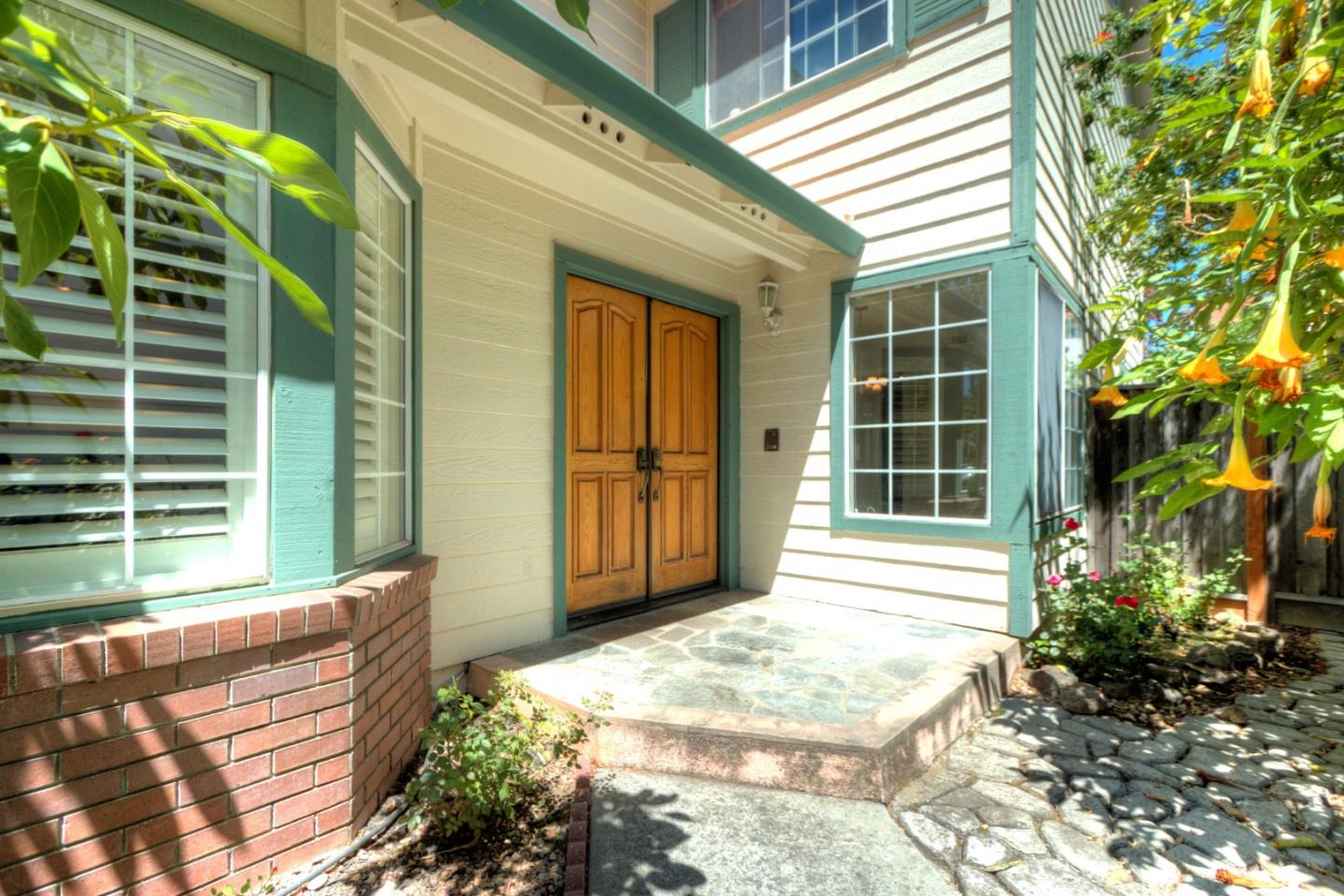 2201 Pinard Street Milpitas, CA 95035 - Photo 2 of 26 a front view of a house with a yard