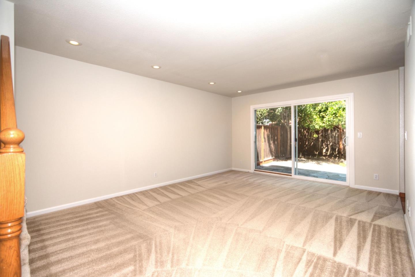2201 Pinard Street Milpitas, CA 95035 - Photo 3 of 26 a view of an empty room with wooden floor and a window