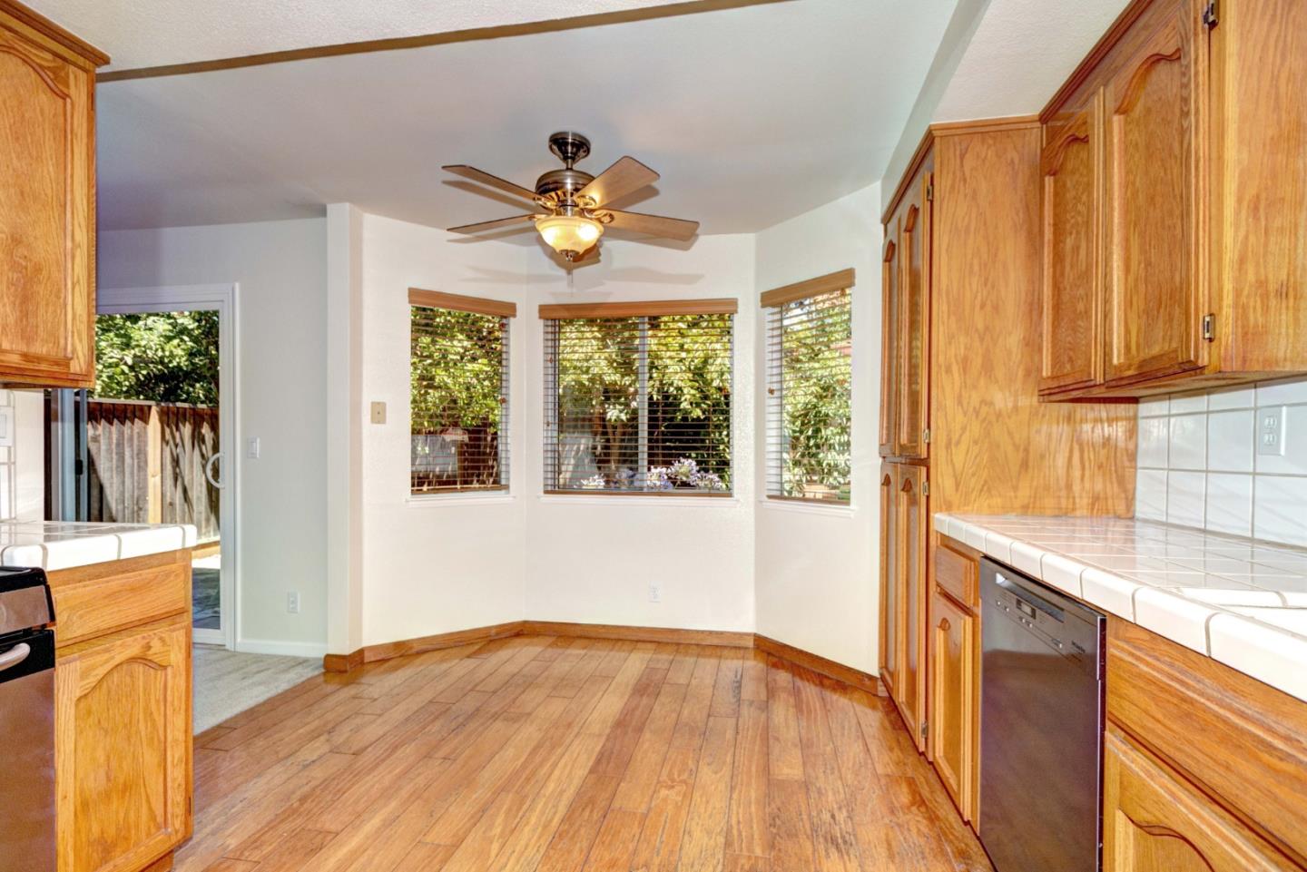2201 Pinard Street Milpitas, CA 95035 - Photo 6 of 26 a view of a kitchen with wooden floor and a window