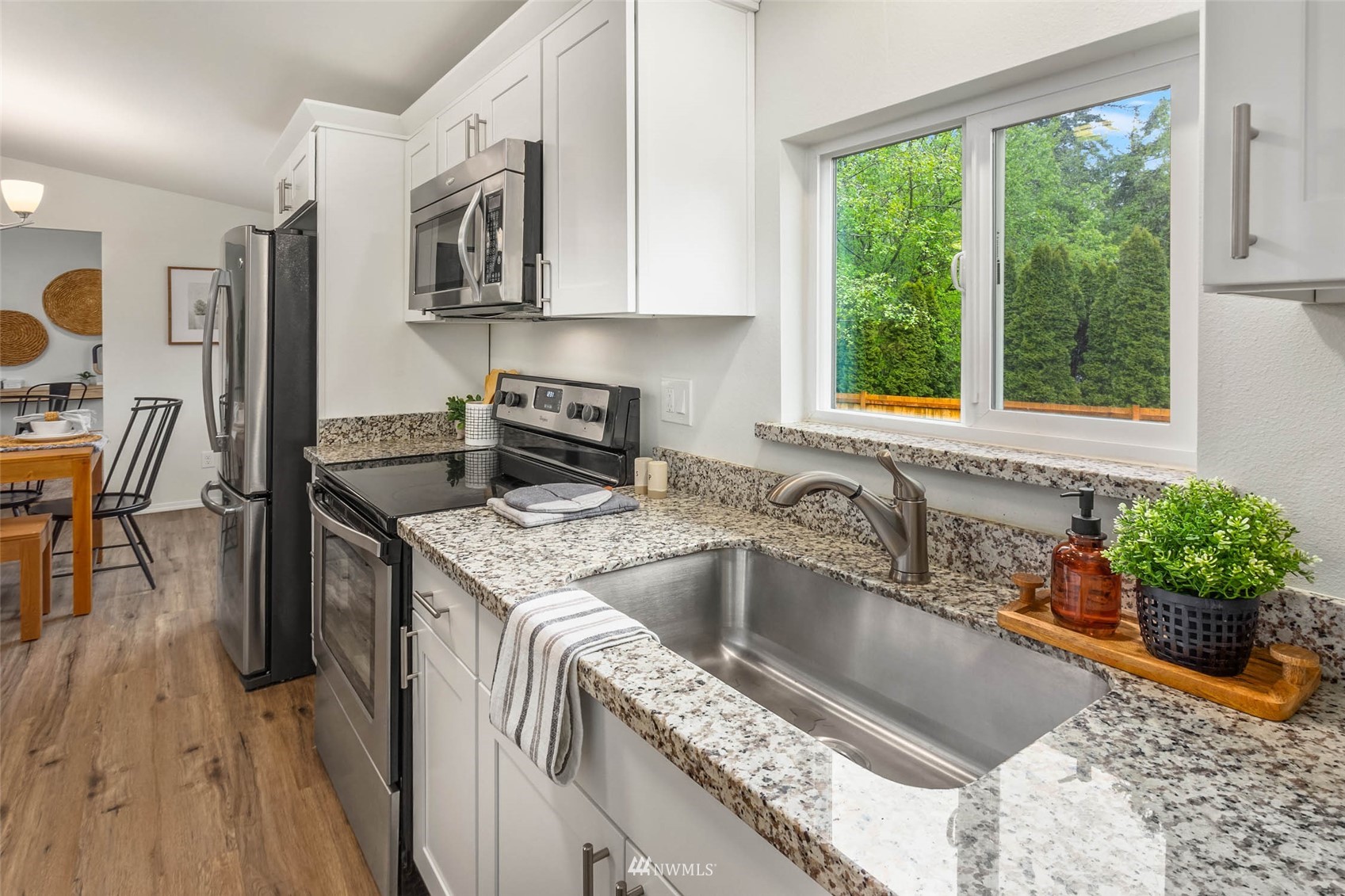 10701 Holly Drive Everett, WA 98204 - Photo 14 of 33 a kitchen that has a sink and a stove