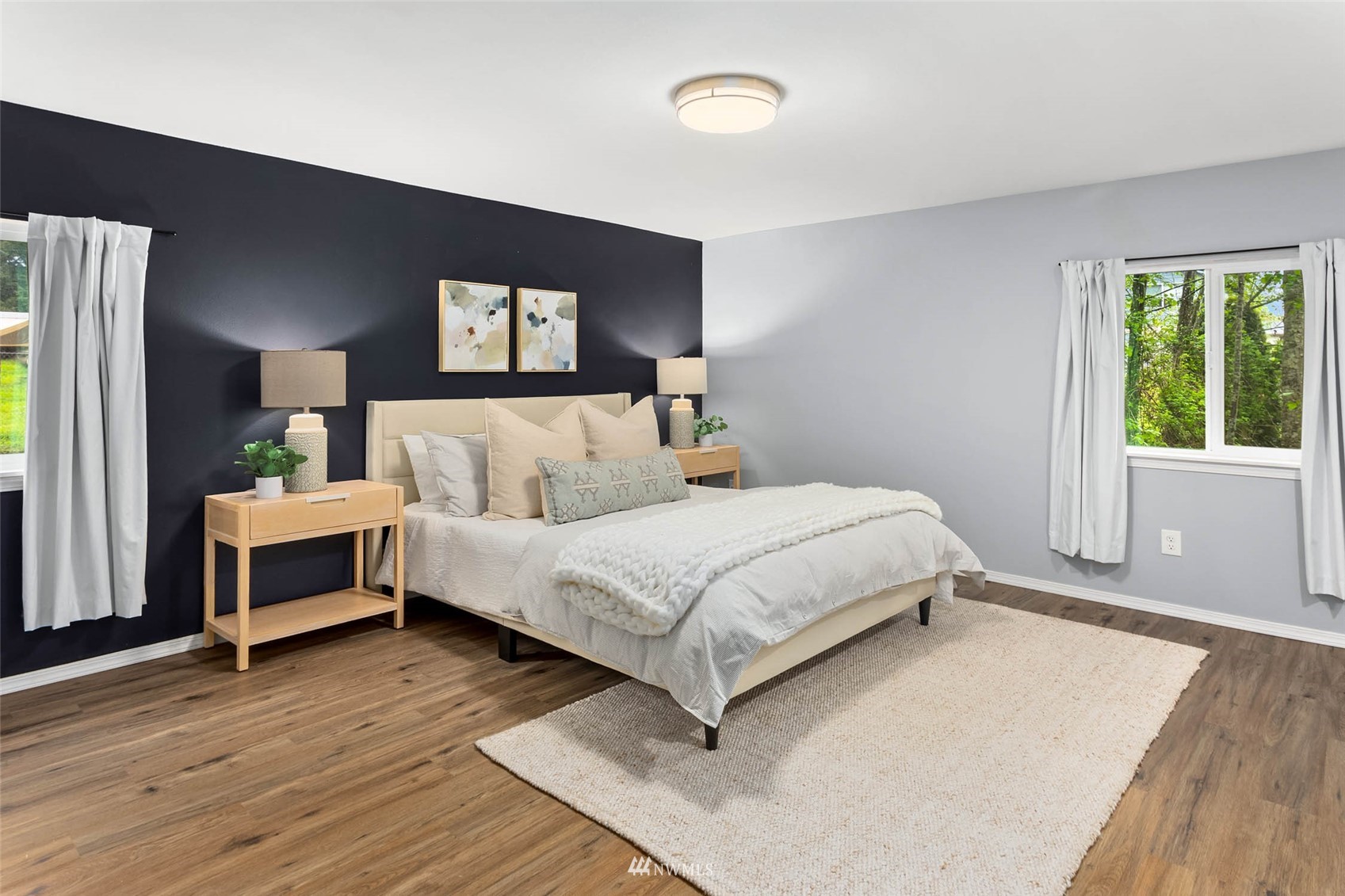 10701 Holly Drive Everett, WA 98204 - Photo 20 of 33 a bedroom with a bed and a night stand