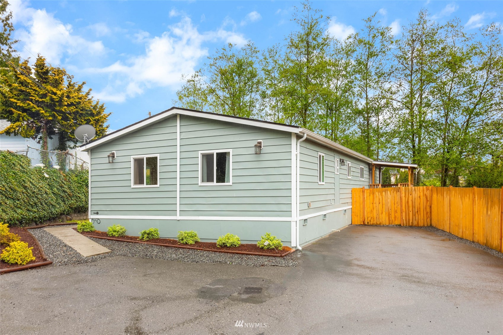10701 Holly Drive Everett, WA 98204 - Photo 2 of 33 a front view of house along with trees