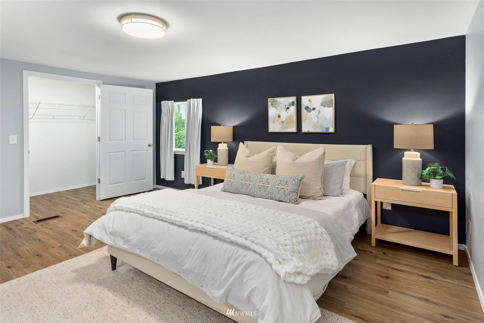 10701 Holly Drive Everett, WA 98204 - Photo 21 of 33 a bedroom with a bed and a lamp