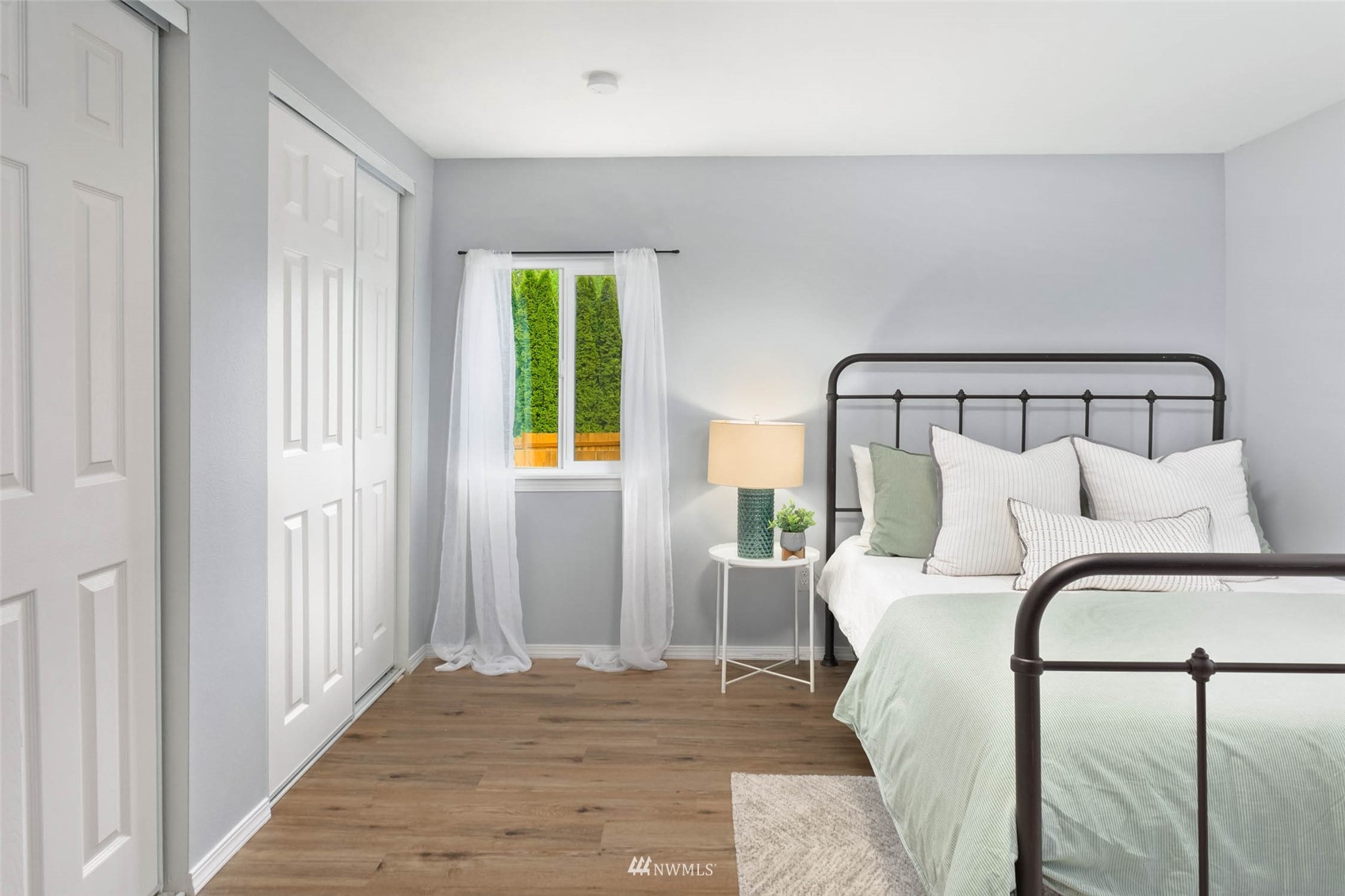 10701 Holly Drive Everett, WA 98204 - Photo 25 of 33 a bedroom with a bed and a window