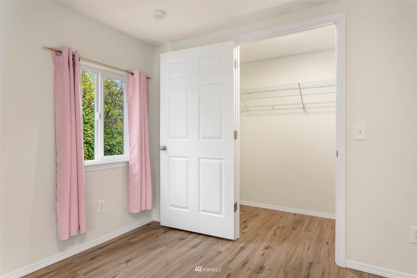 10701 Holly Drive Everett, WA 98204 - Photo 27 of 33 a view of an empty room with wooden floor and a window