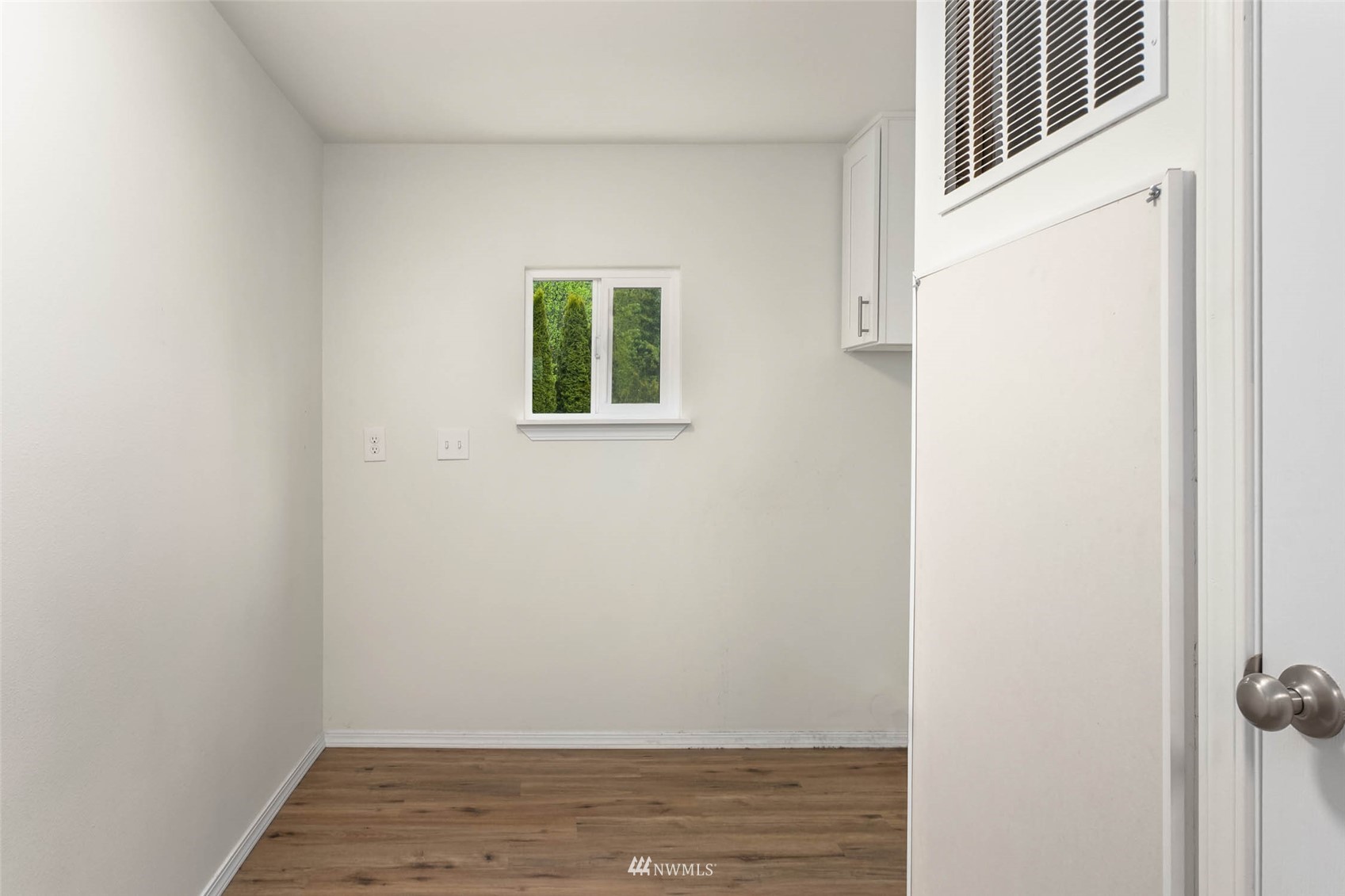 10701 Holly Drive Everett, WA 98204 - Photo 29 of 33 a view of a closet area with wooden floor