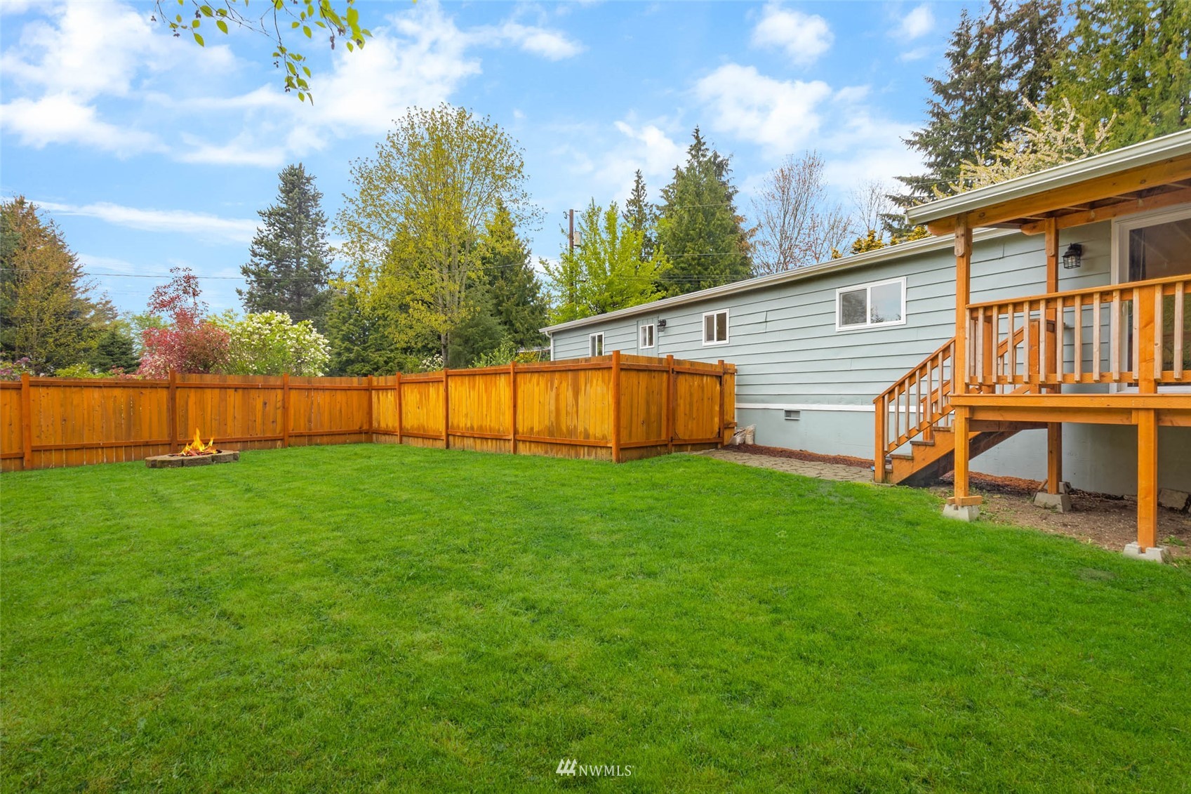 10701 Holly Drive Everett, WA 98204 - Photo 31 of 33 a view of a house with a backyard