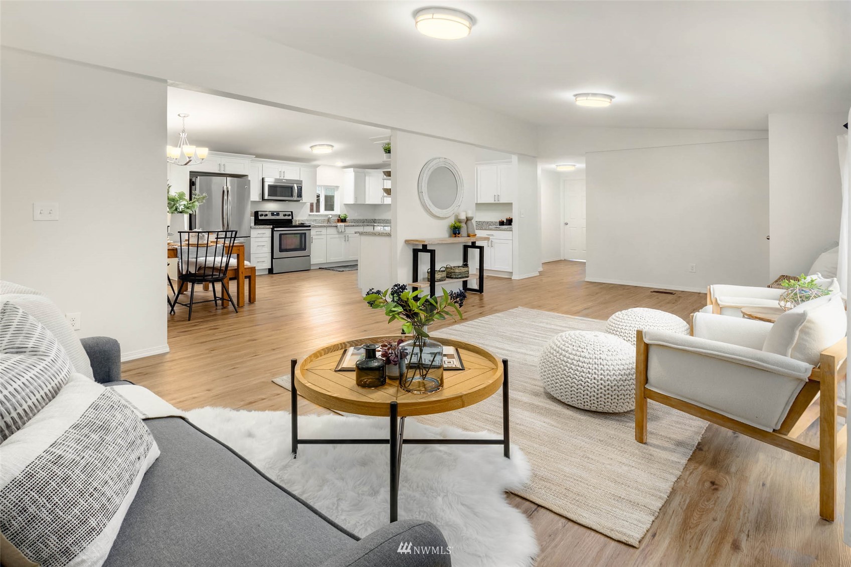10701 Holly Drive Everett, WA 98204 - Photo 9 of 33 a living room with furniture kitchen view and a table