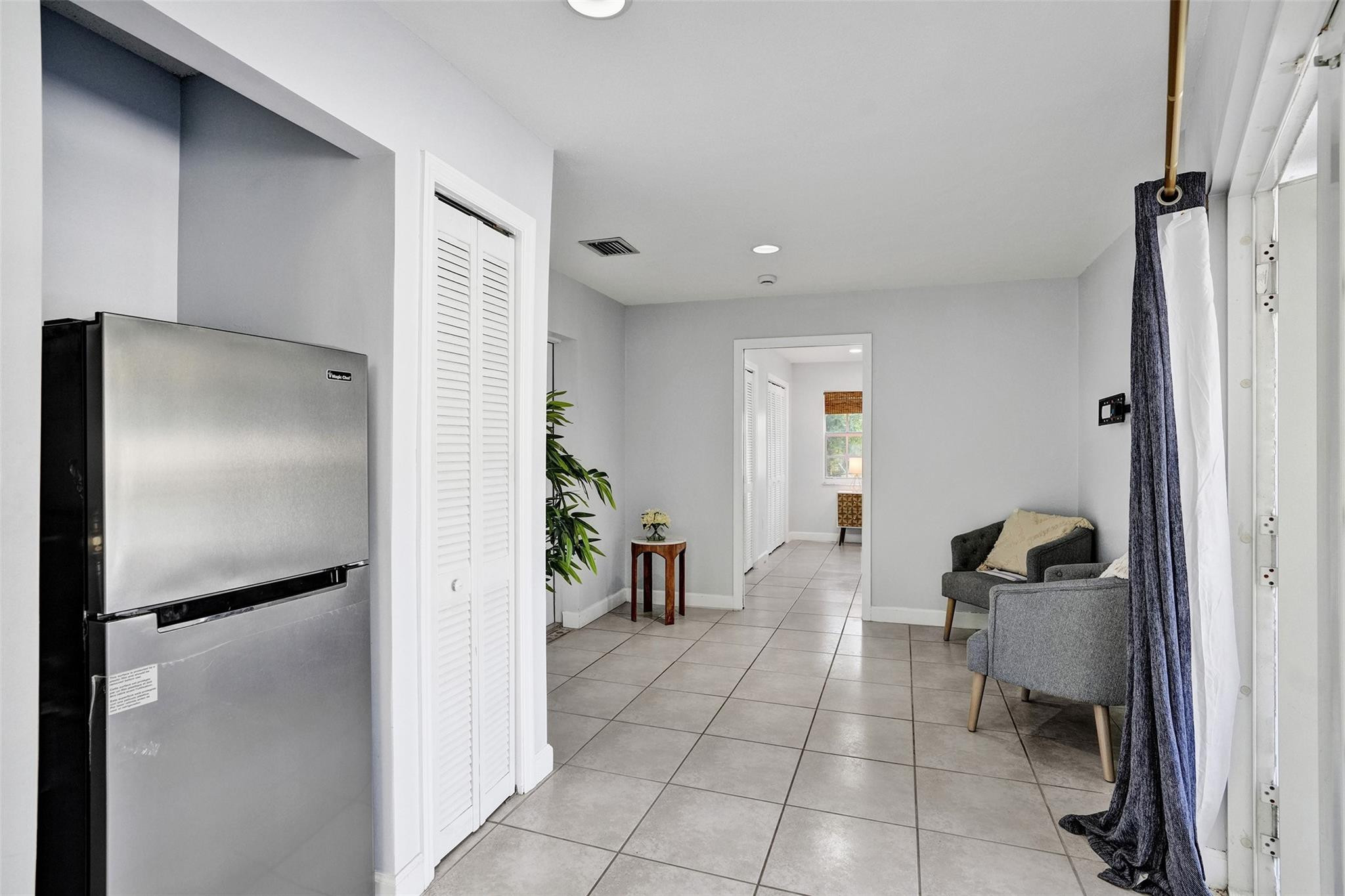 14930 Southwest 145th Street Miami, FL 33196 - Photo 70 of 94 In-Laws quarters fridge and living room