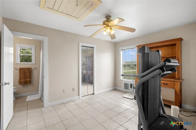 a view of a livingroom with a flat tv screen and dresser
